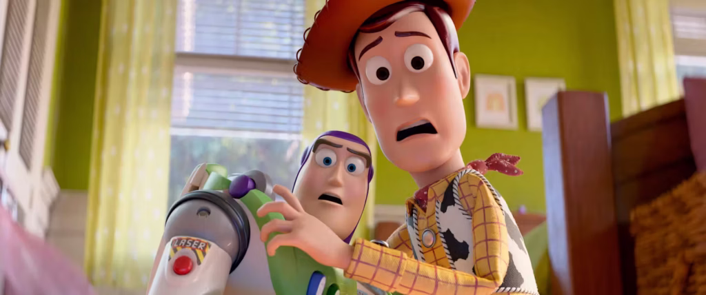 An extreme close-up shot of Woody and Buzz Lightyear from Toy Story 5 looking forward with expressions of shock and alarm. Woody is in the foreground on the right, his mouth open in surprise, while Buzz is just behind him on the left, holding onto his green arm piece. The background shows a brightly lit child's bedroom with green walls, yellow curtains, and a window.